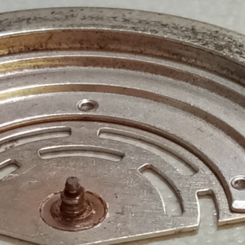 Rolex caliber 3135 rotor with worn rotor bolts after 15 years without service