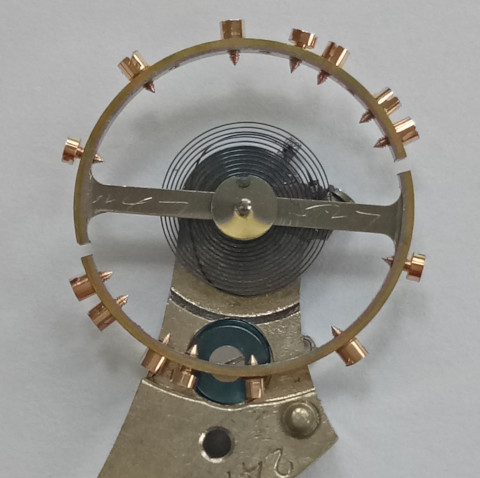 Compensation Balance with Breguet hairspring and cock.
